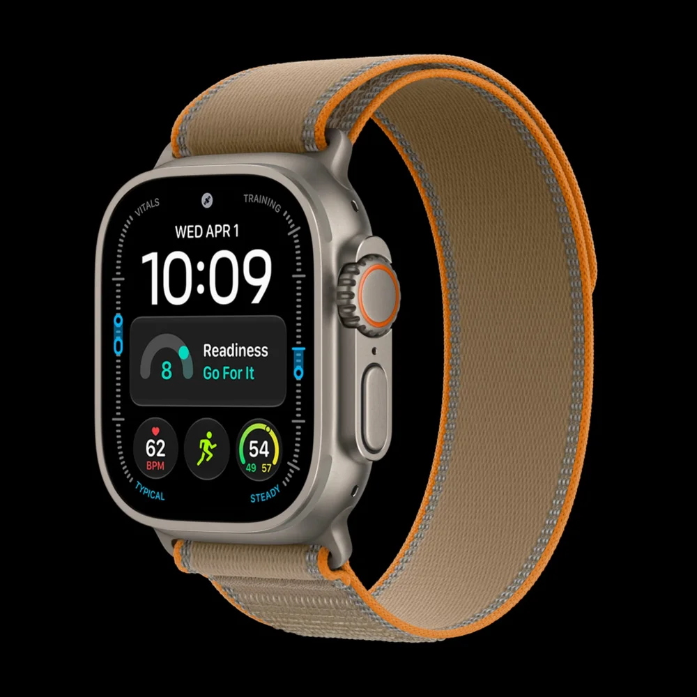 The natural titanium Apple Watch Ultra 4 with the Trail Loop in sand.
