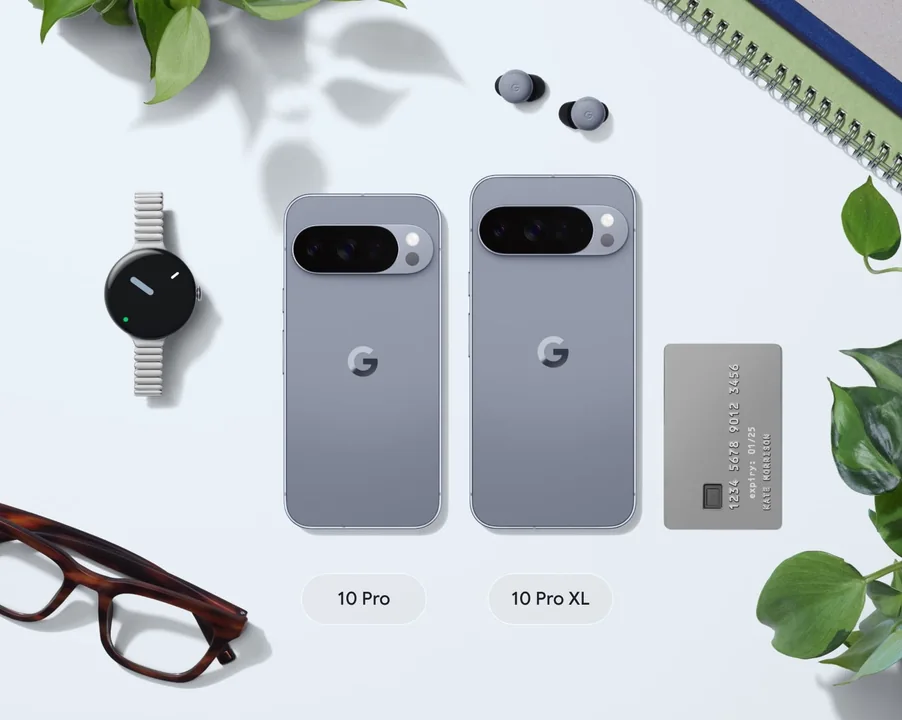 Pixel 10 Pro and Pro XL side-by-side, surrounded by a Pixel Watch 4, pair of Pixel Buds 2a, credit card, and pair of glasses for scale