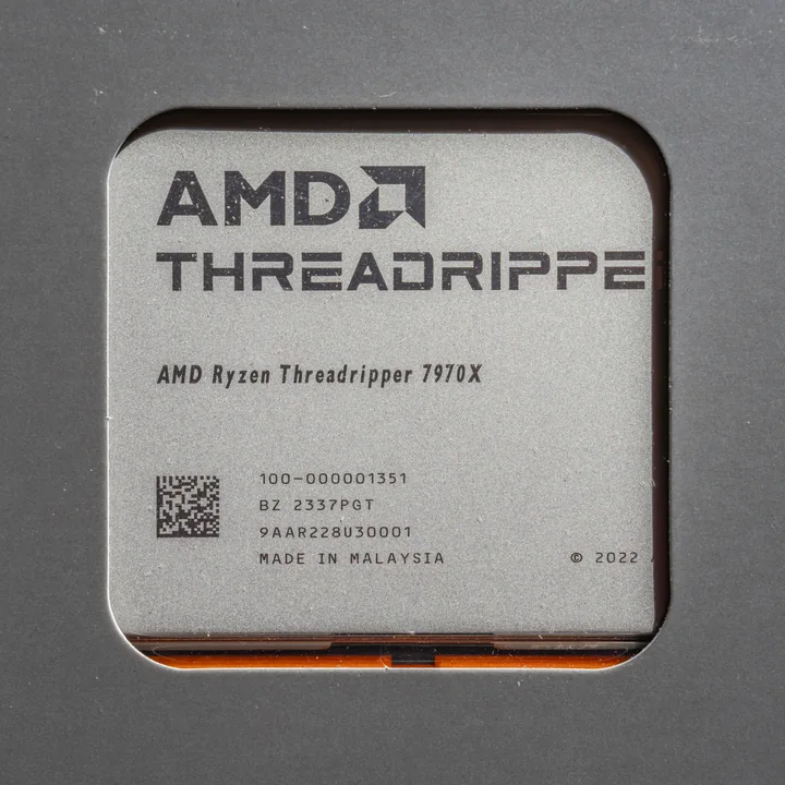 AMD Ryzen Threadripper 7970X physical processor in its packaging, representing the 7000-series family
